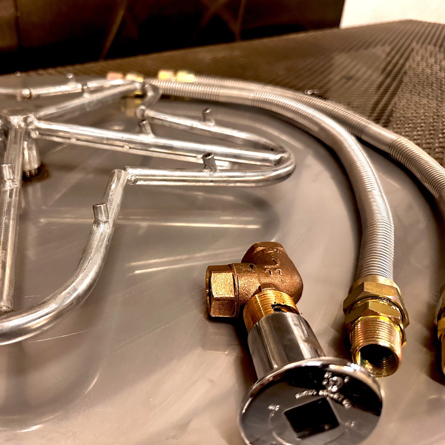 A closeup on a components of a 18″ Burner, 19-24″ Torpedo Penta Burner Kit, Custom