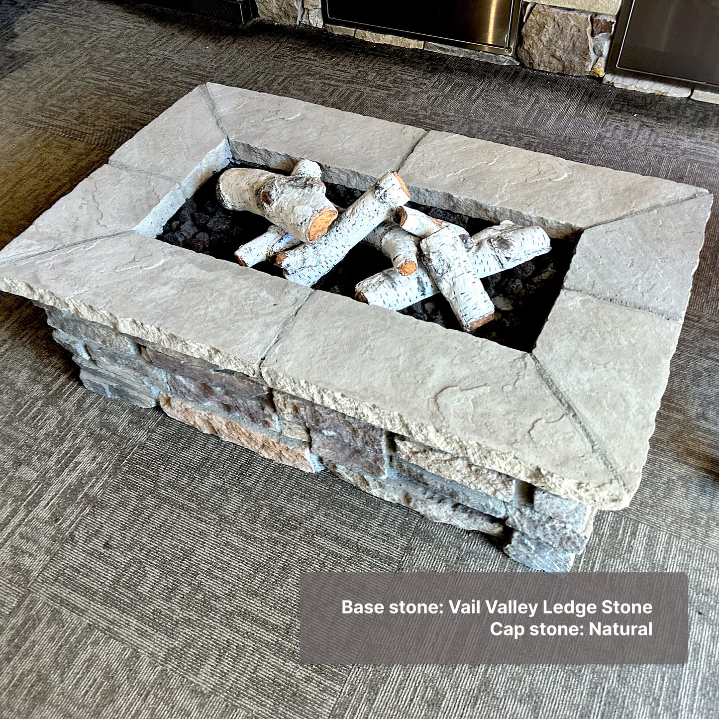 48" x 30" custom stone fire pit shown with Aspen log set