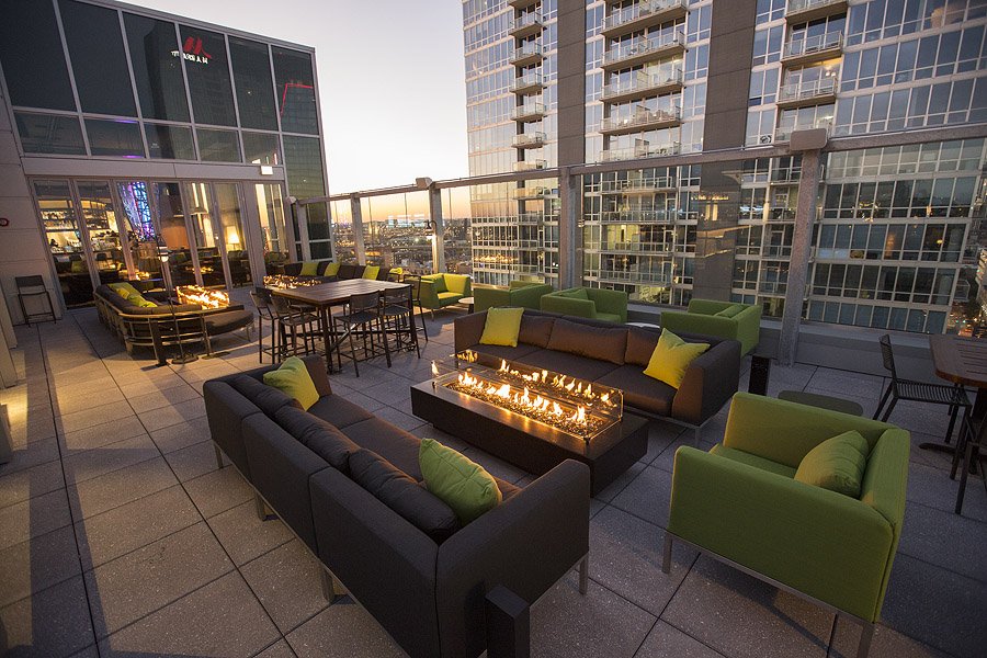 96" Del Mar Fire Pit in Black on a modern shared condo patio.