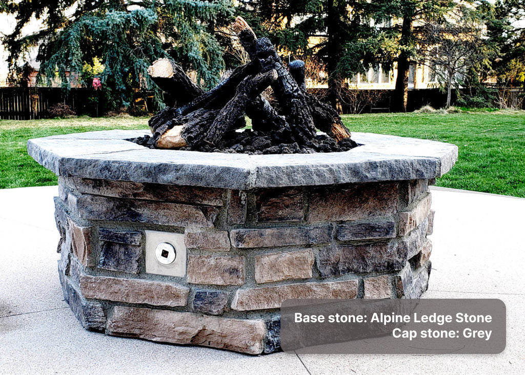 custom gas fire pit with "Alpine Ledge Stone" base and "Grey" cap stone