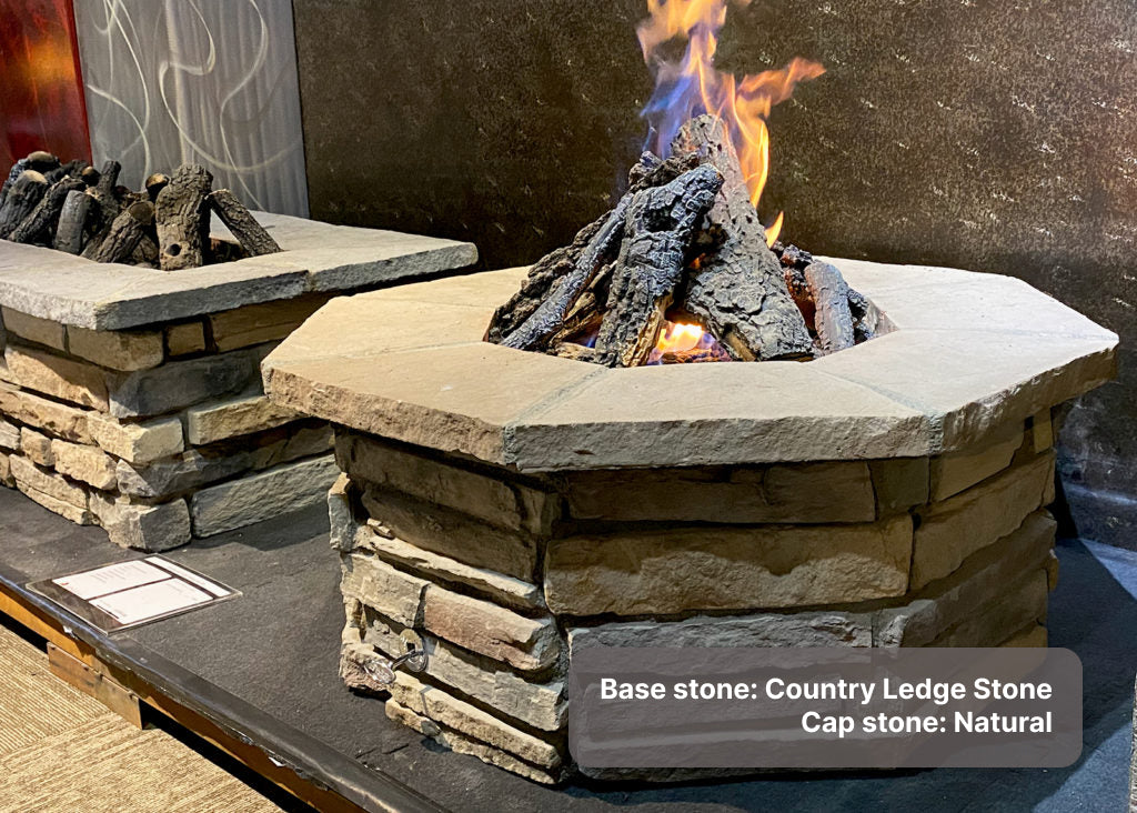 custom stone fire pit with "Natural" cap stone and "Country Ledge" Country Ledge base stone with Charred Campfire log set