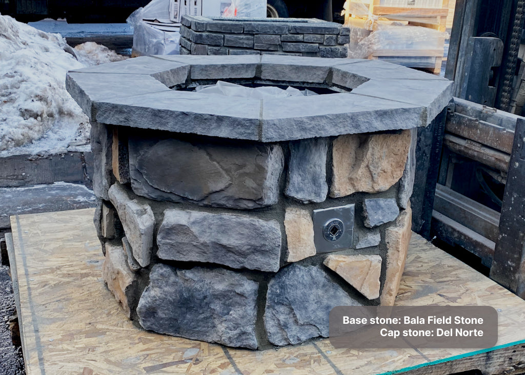 Gas fire pit with "Bala" Field Stone and "Del Norte" cap