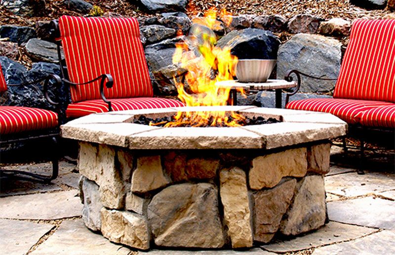 Custom stone fire pit with "Natural Fieldstone" base & "Natural" cap stones