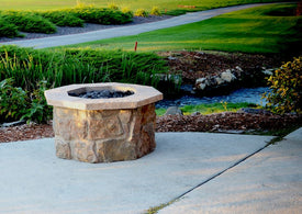 36" octagon custom stone gas fire pit with "moss rock base" and  "natural cap stones